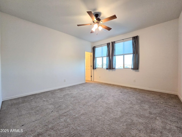 19954 W Moonlight Path, Buckeye, AZ 85326 - carpeted empty room featuring a ceiling fan and baseboards