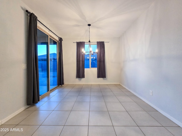 19954 W Moonlight Path, Buckeye, AZ 85326 - unfurnished room featuring a chandelier, tile patterned flooring, and baseboards