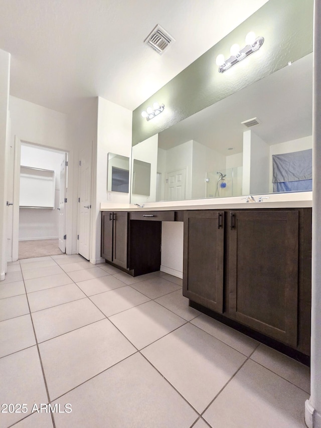 19954 W Moonlight Path, Buckeye, AZ 85326 - full bathroom with tile patterned floors, a walk in shower, and vanity