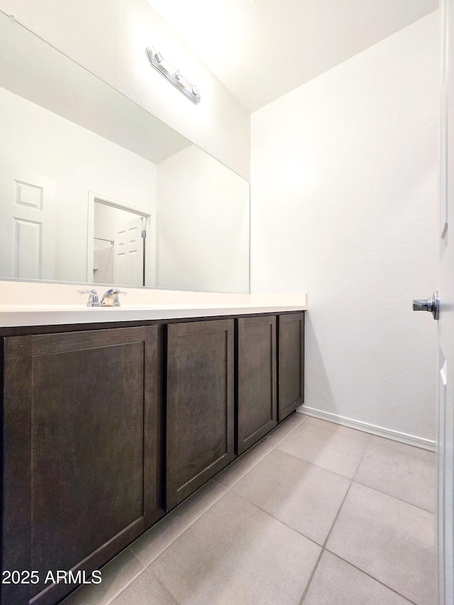 19954 W Moonlight Path, Buckeye, AZ 85326 - bathroom featuring tile patterned flooring, vanity, and baseboards