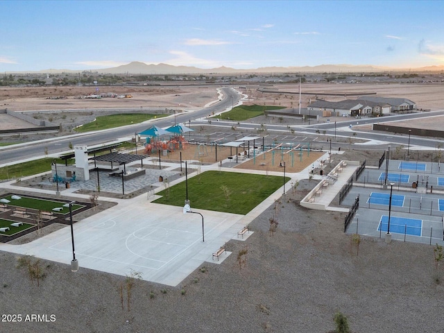 birds eye view of property with a mountain view