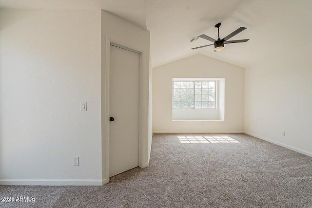 spare room with ceiling fan, carpet, and lofted ceiling