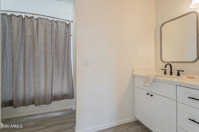 bathroom with vanity and shower / bath combo