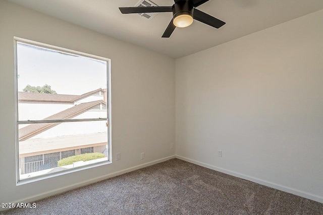 empty room featuring carpet flooring and ceiling fan