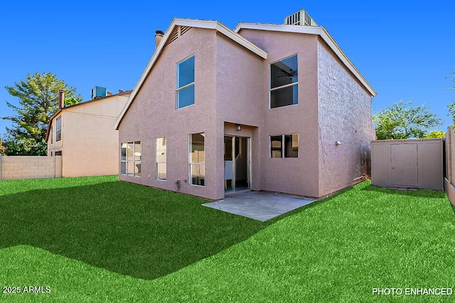 back of property featuring central air condition unit, a shed, a lawn, and a patio