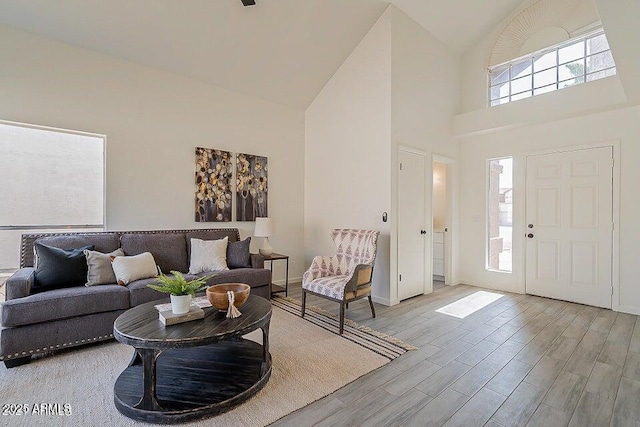 foyer entrance with high vaulted ceiling and a wealth of natural light