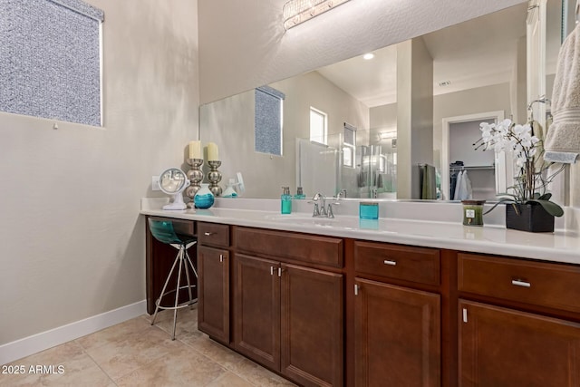 bathroom with tile patterned floors and vanity