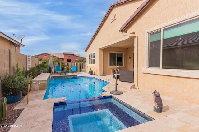 view of pool featuring an in ground hot tub and a patio