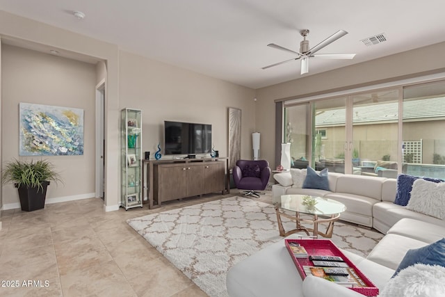 living room with light tile patterned floors and ceiling fan