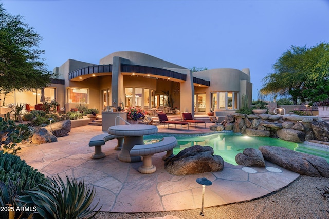 pool with a patio area