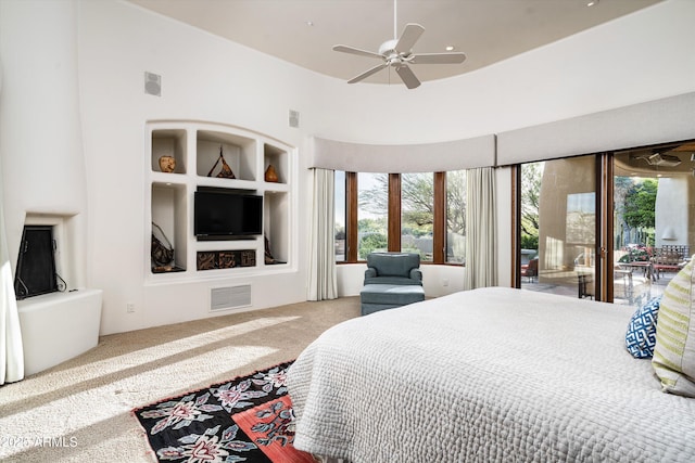 bedroom featuring carpet floors, access to outside, and visible vents