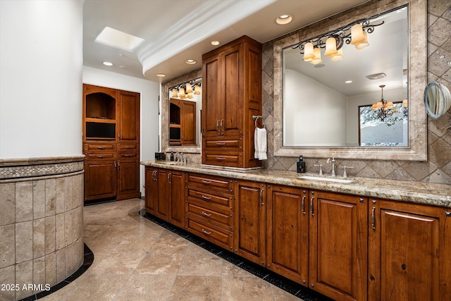 full bath with double vanity, a sink, and recessed lighting