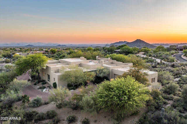 aerial view at dusk with a mountain view
