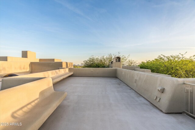 patio terrace at dusk with a balcony