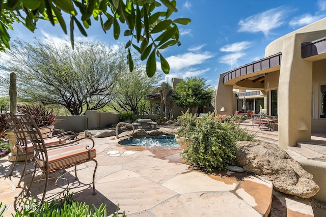 view of patio / terrace with fence and a fenced in pool