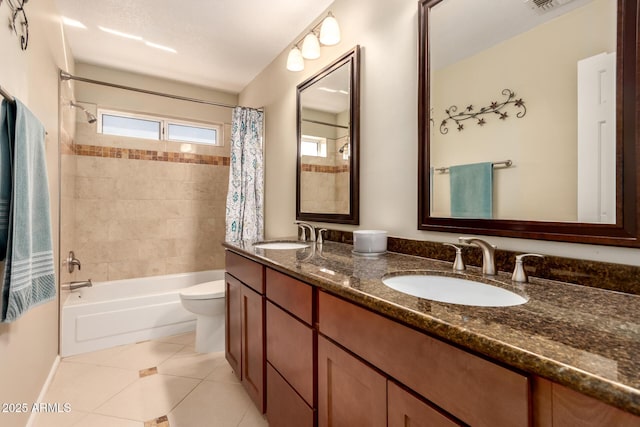 full bathroom featuring toilet, tile patterned flooring, vanity, and shower / bathtub combination with curtain