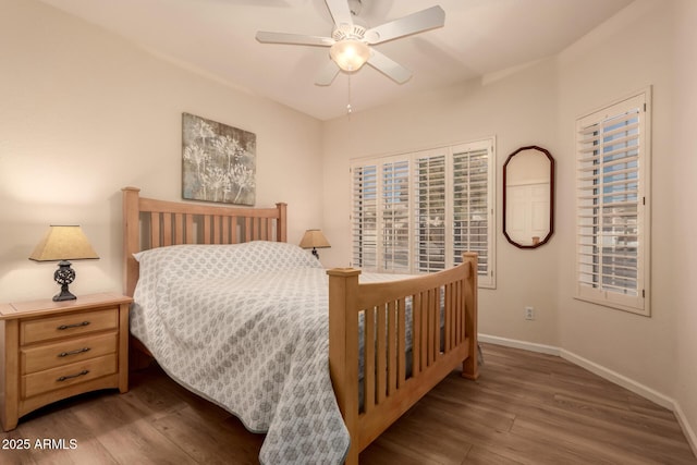 bedroom featuring ceiling fan and dark hardwood / wood-style floors