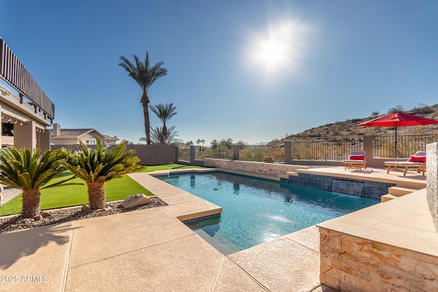 view of pool featuring pool water feature and a patio area