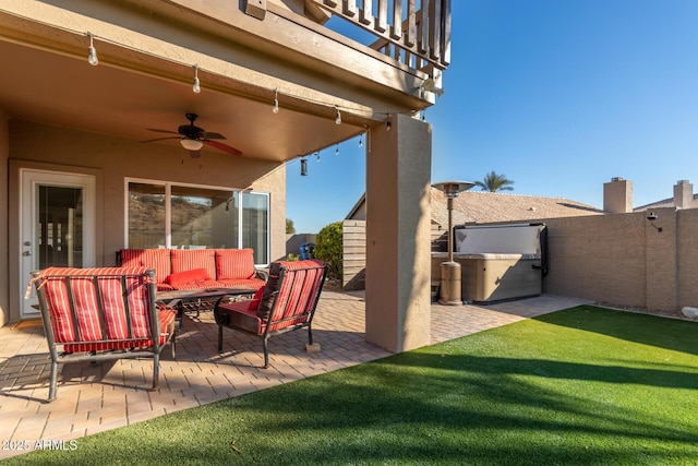 view of patio / terrace featuring ceiling fan and an outdoor living space