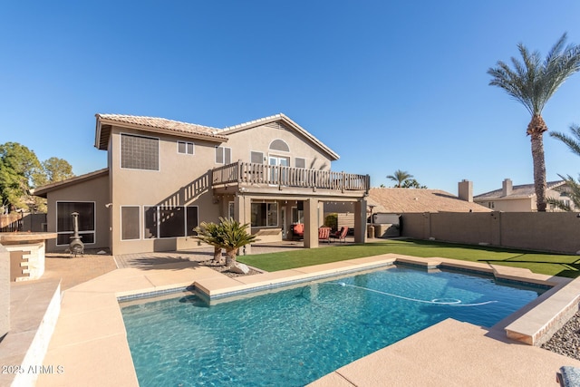 view of pool featuring a patio and a lawn