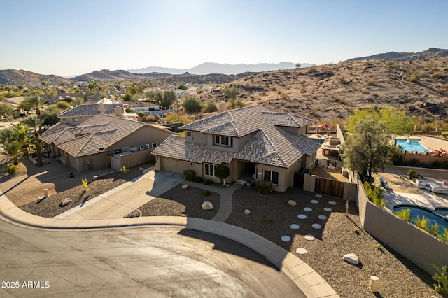 birds eye view of property featuring a mountain view