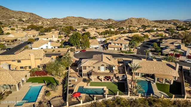 birds eye view of property featuring a mountain view