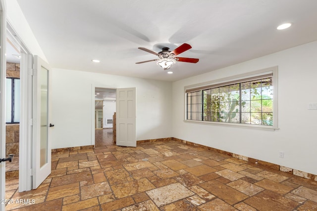 unfurnished bedroom featuring ceiling fan