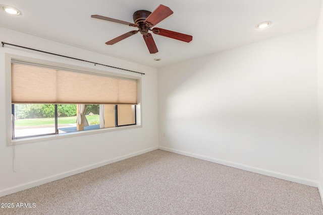 unfurnished room featuring ceiling fan and carpet floors