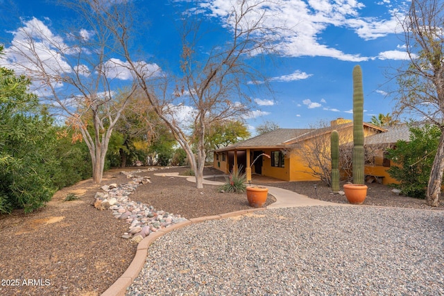 rear view of property featuring a patio