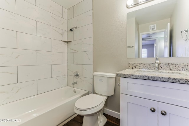 full bath featuring shower / bath combination, baseboards, visible vents, toilet, and vanity