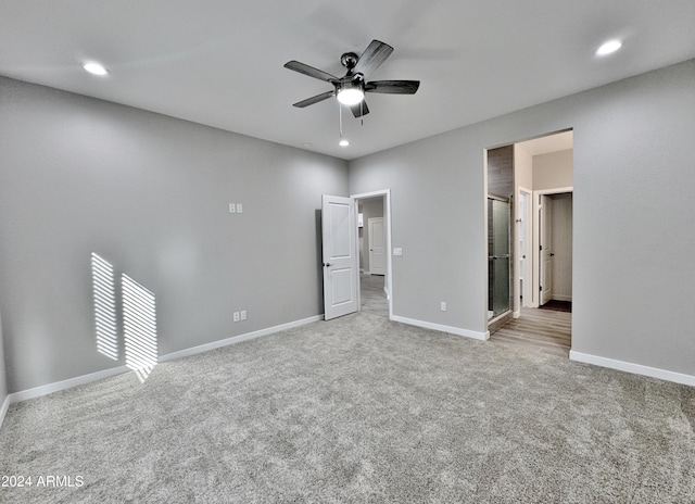 unfurnished bedroom featuring ceiling fan and light carpet