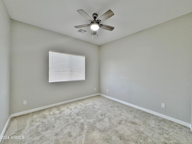 carpeted empty room with ceiling fan