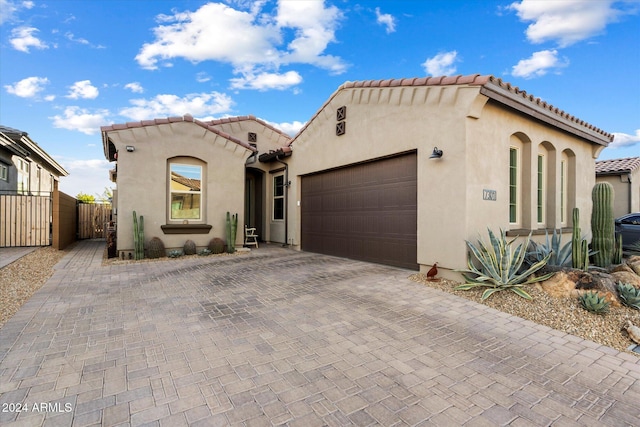 mediterranean / spanish house featuring a garage