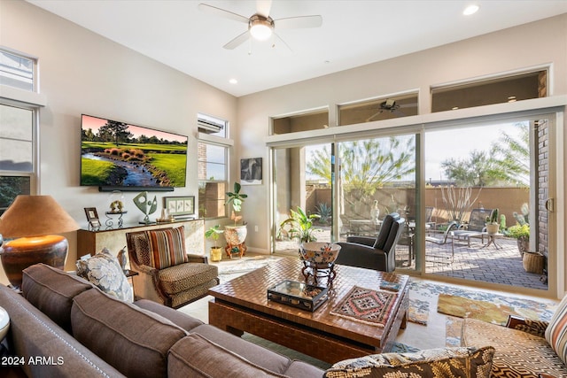 living room featuring a wealth of natural light and ceiling fan