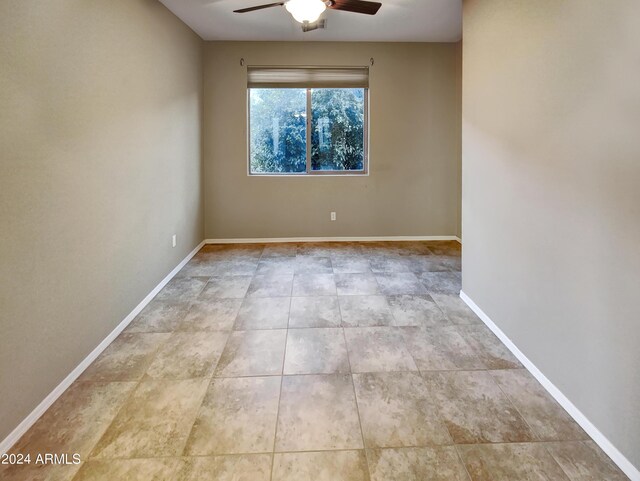 unfurnished room with ceiling fan