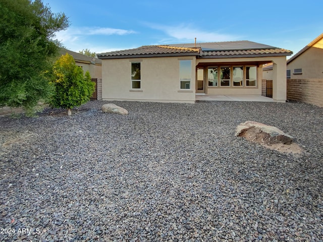 rear view of property with a patio area