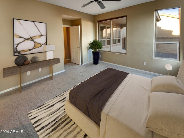 carpeted bedroom with ceiling fan and a closet