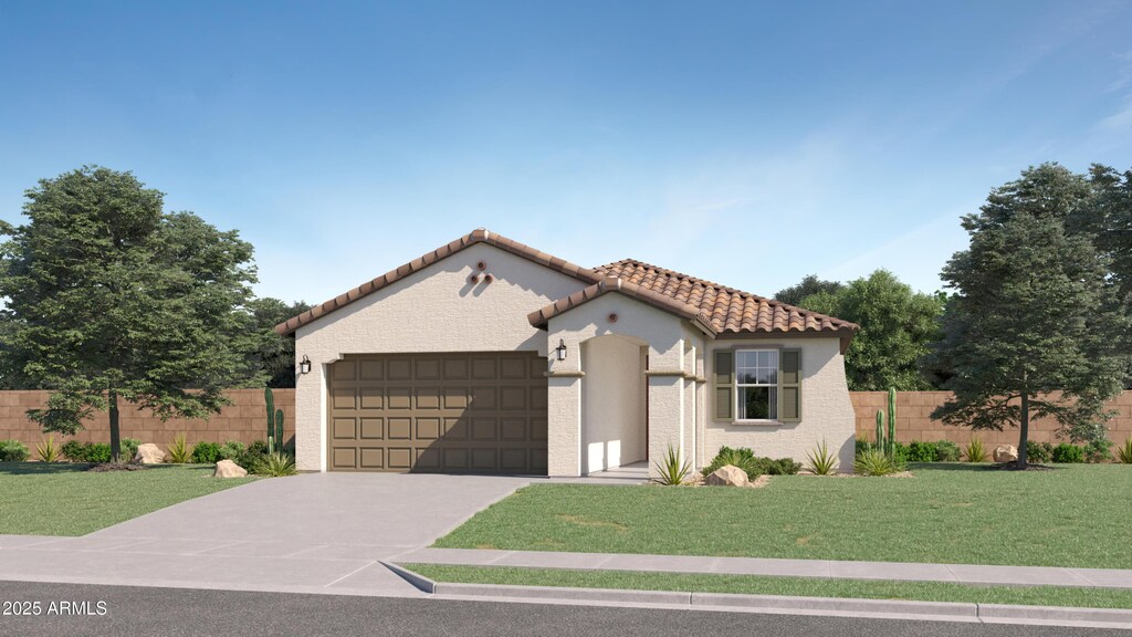 mediterranean / spanish house featuring a front lawn and a garage