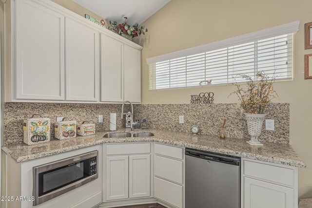 1121 W Mission Dr, Chandler, AZ 85224 - kitchen featuring appliances with stainless steel finishes, a sink, tasteful backsplash, white cabinets, and light stone counters