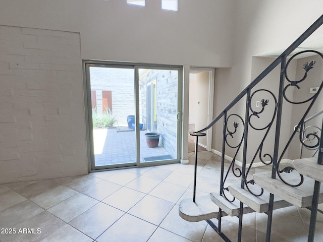 7770 E Camelback Rd Unit 23, Scottsdale, AZ 85251 - interior space with plenty of natural light, tile patterned flooring, and a high ceiling