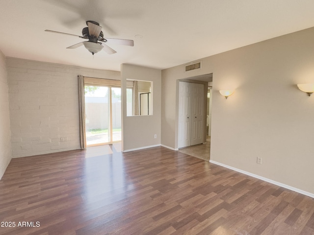 7770 E Camelback Rd Unit 23, Scottsdale, AZ 85251 - unfurnished room featuring a ceiling fan, wood finished floors, and baseboards