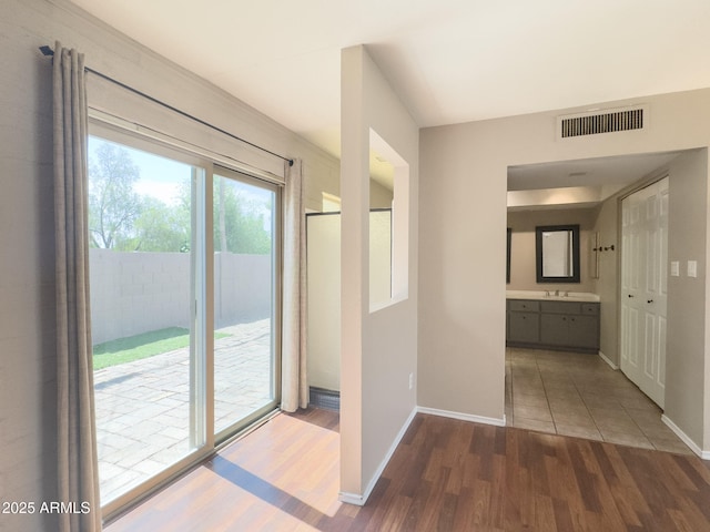7770 E Camelback Rd Unit 23, Scottsdale, AZ 85251 - corridor with wood finished floors and baseboards