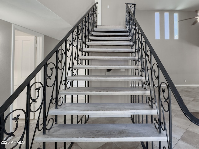 7770 E Camelback Rd Unit 23, Scottsdale, AZ 85251 - stairs with ceiling fan, tile patterned flooring, and baseboards