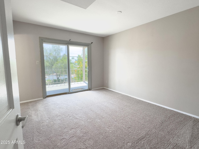 7770 E Camelback Rd Unit 23, Scottsdale, AZ 85251 - carpeted spare room featuring baseboards
