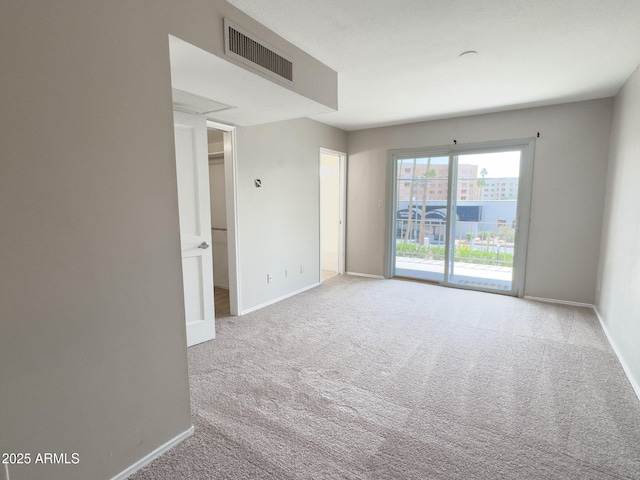 7770 E Camelback Rd Unit 23, Scottsdale, AZ 85251 - empty room featuring carpet flooring and baseboards