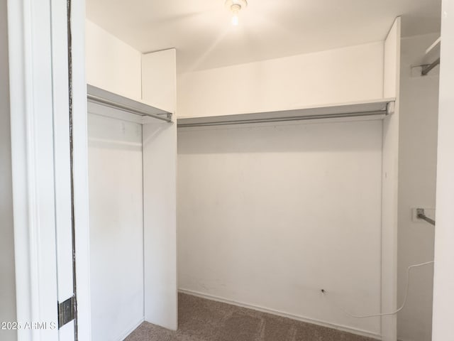 7770 E Camelback Rd Unit 23, Scottsdale, AZ 85251 - spacious closet featuring carpet floors