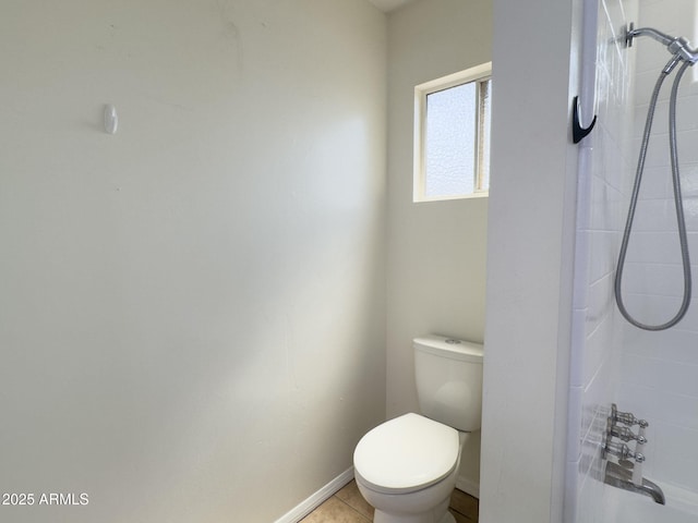 7770 E Camelback Rd Unit 23, Scottsdale, AZ 85251 - bathroom featuring toilet, shower / bath combination, baseboards, and tile patterned flooring