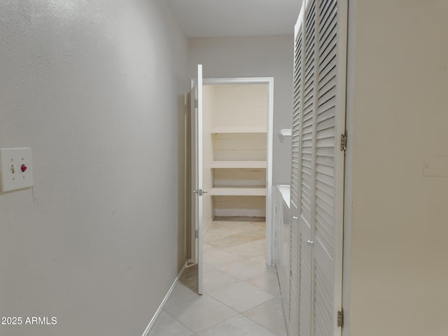 7770 E Camelback Rd Unit 23, Scottsdale, AZ 85251 - corridor with light tile patterned flooring and baseboards