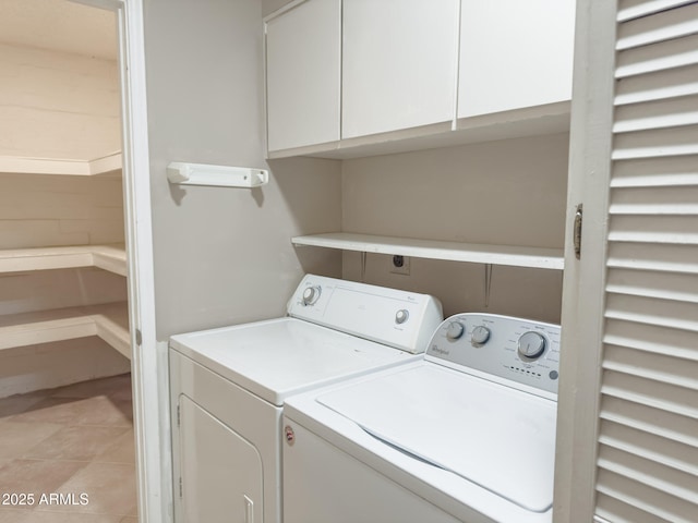 7770 E Camelback Rd Unit 23, Scottsdale, AZ 85251 - laundry area featuring cabinet space, washing machine and clothes dryer, and light tile patterned flooring