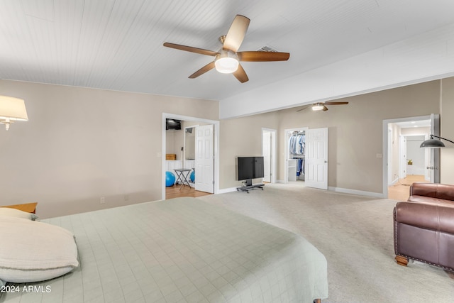 carpeted bedroom featuring ceiling fan and a closet